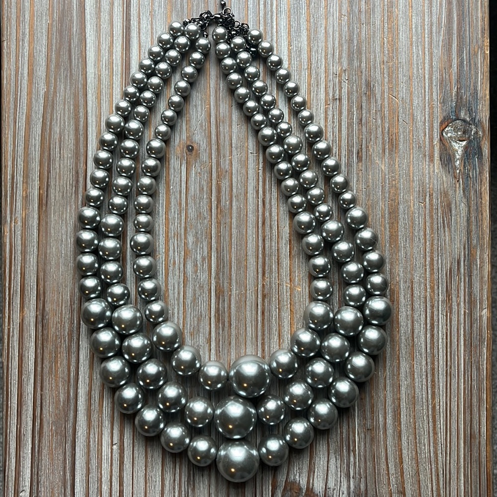 Three strand faux pearl necklace